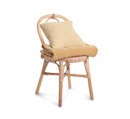 Wicker chair with cushion and blanket isolated on white background