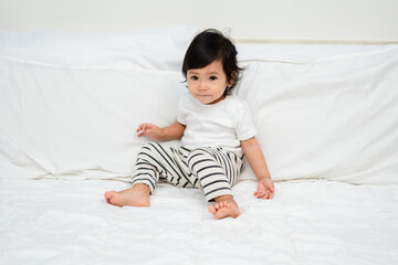 toddler baby on bed