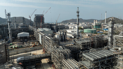 Fototapeta premium industrial plant construction, large new oil refinery and petrochemical construction project, aerial view