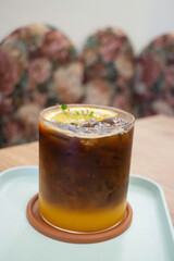 Black orange iced coffee drink