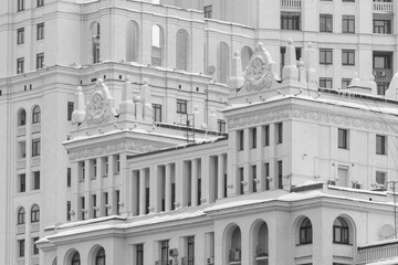 Architectural fragment of a building in the late Soviet Empire style. Black and white.