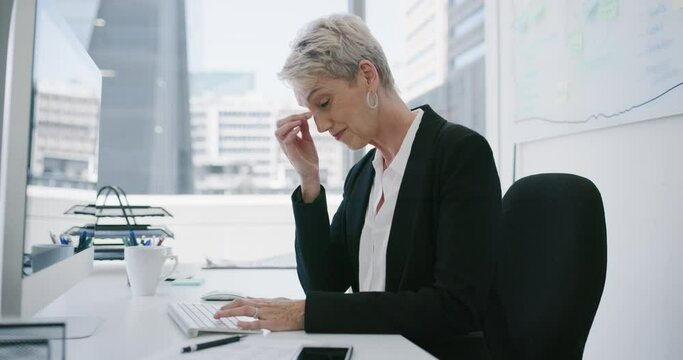 Business woman, headache and stress on computer for human resources mistake, error or time management fail. Mature person with fatigue tired or pain at her office desk for report, deadline or burnout