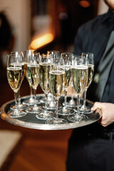Waiter serving champagne