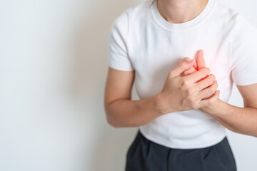 Woman hand holding chest ache. Heart disease, angina disease and symptom heart attack disease...