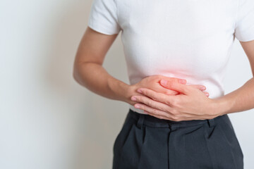 Woman having Stomach pain. Ovarian and Cervical cancer, Cervix disorder, Endometriosis, Hysterectomy, Uterine fibroids, Reproductive system, menstruation, diarrhea, digestive system and Pregnancy