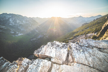 Setting Sun Over Alpine Cliff