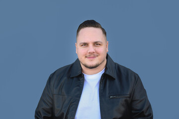 Young attractive man looking friendly to the camera