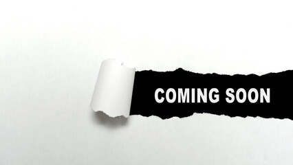 Ripped paper with 'coming soon' text