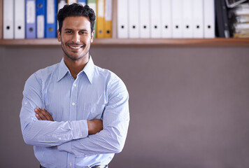 Office, portrait and happy businessman with arms crossed in confidence and pride as entrepreneur. Corporate, employee and man with a smile for working on investment portfolio or workplace mock up