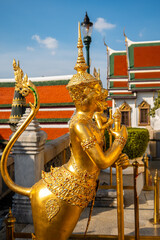Fototapeta premium Golden hanuman god statue at Temple of Emerald Buddha in Bangkok, Thailand.