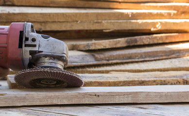 Electric sandpaper tool on wooden table