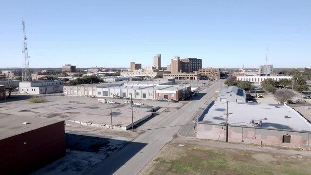Downtown Abilene, Texas with drone video moving up.