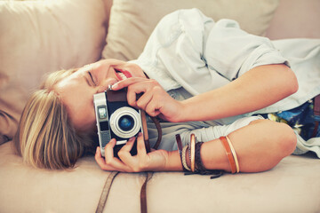 Woman, camera and couch for retro, photography and fashion in casual outfit for hobby at home....