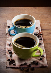 Two cups of coffee on wooden table