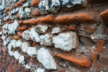 Red brick and stone, old wall in perspective