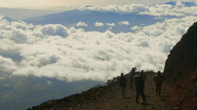 People trekking on the top of a mountain