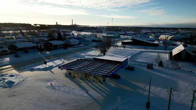 A Dark Shadow Drone Wide Shot of the NCN Reservation Small Town Gas Station in Thompson Manitoba Northern Remote Canada