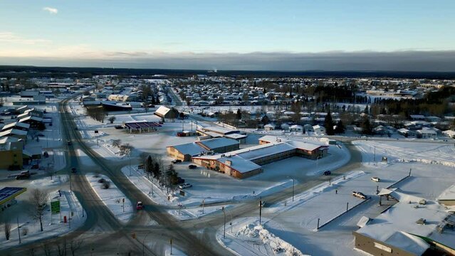 A Rising Aerial Drone Wide Shot of the NCN Reservation Small Town Gas Station in Thompson Manitoba Northern Remote Canada
