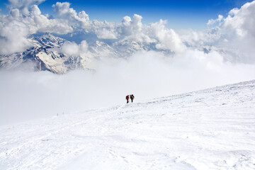 Fototapeta na wymiar Mountaineer climbing in snowy mountains.