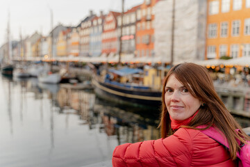 Tourism. A woman walks in the city of Copenhagen. Denmark.
