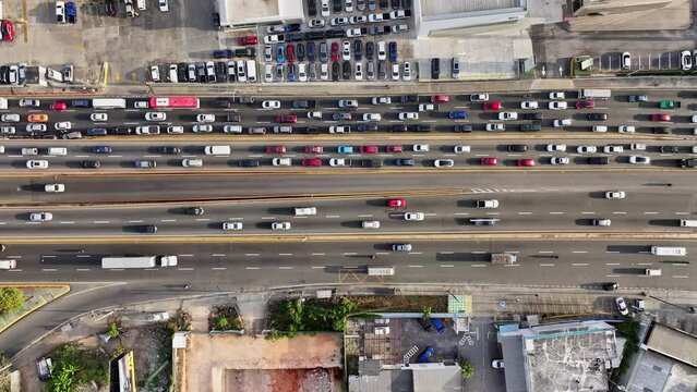 Aerial top down traffic jam in one way and flowing lane other side