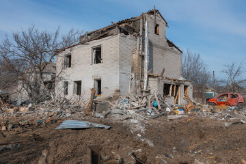Consequences of a rocket explosion on a private house. War in Ukraine. Remains of a private house...