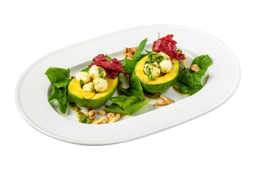 Bocconcini cheese balls in halves of avocado served with salad on white background