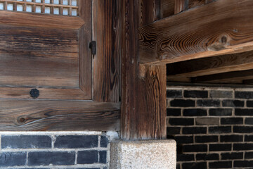 the wooden column sustaining the balcony in the old traditional Korean building