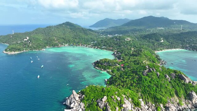 Tropical paradise in the Gulf of Thailand, Koh Tao boasts pristine beaches, vibrant coral reefs for diving, and lush jungles for exploration. Aerial view from drone. High-quality video. 4K.
