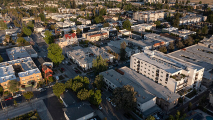 Sunset aerial view of dense housing in the San Fernando valley neighborhood of Canoga Park of Los Angeles, California, USA. - obrazy, fototapety, plakaty