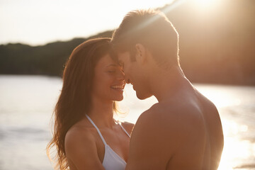 Love, sunset and couple on island for date on romantic anniversary vacation, adventure or holiday....