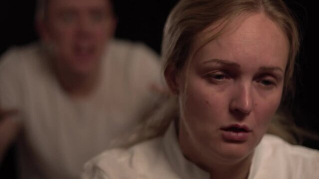 A man is angry at a woman, screaming at her. Being angry and violent. A couple having an argument over some issue. Jealousy, cheating.