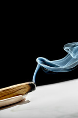 A block of Palo Santo wood is burning. Aromatic smoke for meditation and healing