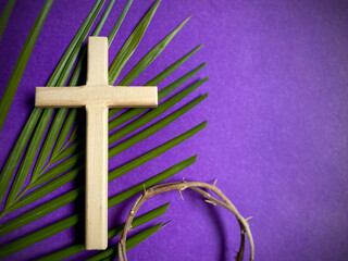 Holy Week, Lent, Palm Sunday, Good Friday, Easter Sunday Concept. Cross shaped with palm leaf and...
