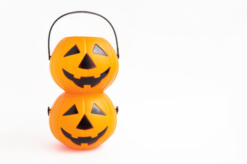 Jack'O pumpkin basket. Halloween cute plastic toy pumpkin head basket on white background.Trick or Treat