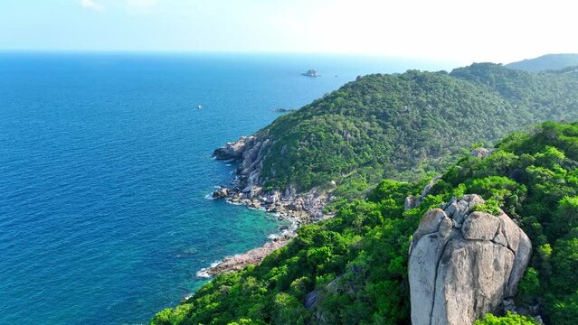 Discover tranquility at Tao Island, a serene paradise boasting pristine beaches and lush landscapes. Unwind in nature's embrace. Aerial view from drone. Stock footage. Sea background. 4K HDR.
