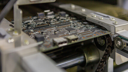 Closeup view of board with chip and semiconductors in special oven