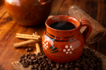 Mexican coffee with cinnamon and piloncillo known as Cafe de Olla. - obrazy, fototapety, plakaty