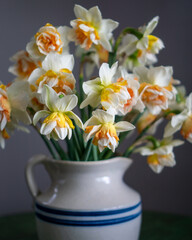 Naklejka na ściany i meble Roseville pottery pitcher with daffodil arrangement
