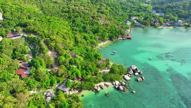Discover Koh Tao's charm, a haven for adventurers with lush jungles, secluded coves, and world-class diving sites. Flight over the ocean. Stock footage. Tropical sea background. 4K HDR.
