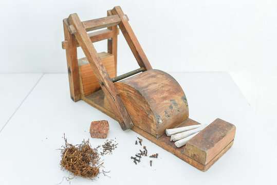 Traditional cigarette rolling machine, used to make unfiltered clove cigarettes