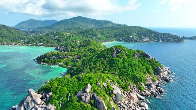 Koh Tao, Thailand offers pristine beaches, vibrant marine life, and captivating diving spots, perfect for a serene getaway. Bird's eye view. Sea stock footage. Tropical background. 4K.
