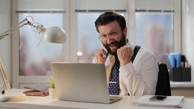 Incredible, shock, happiness emotion. Shocked man in office hysterically rejoices at positive successes of incredible luck. Happy office worker