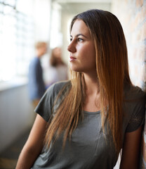 Fototapeta premium Student, woman and thinking on campus or thoughts, idea and vision for project. College person, decide and wonder about education brainstorming, planning and solution for problem solving in corridor