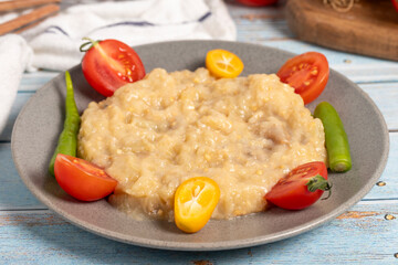 Roasted eggplant salad. Appetizer foods. Eggplant salad on blue wood background. Close up