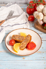 Kadinbudu meatballs. Appetizer dishes. Traditional Turkish meatballs on blue wooden background. local name kadınbudu köfte