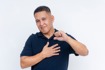 A self-assured middle-aged Asian man gesturing to himself with a chest thump, isolated on a white background.