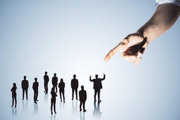 Hand pointing at crowd of businessmen on light backdrop. Worker management concept.