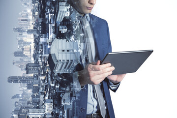 Professional holding a digital tablet merges with the city visuals, representing modern business...
