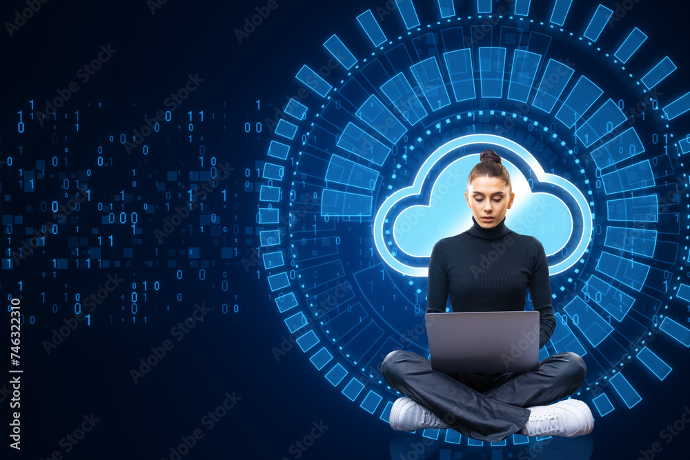 Poster Attractive young european woman using laptop while sitting with creative glowing cloud computing hologram with binary coding on dark blue background. Digital server, support and network concept.